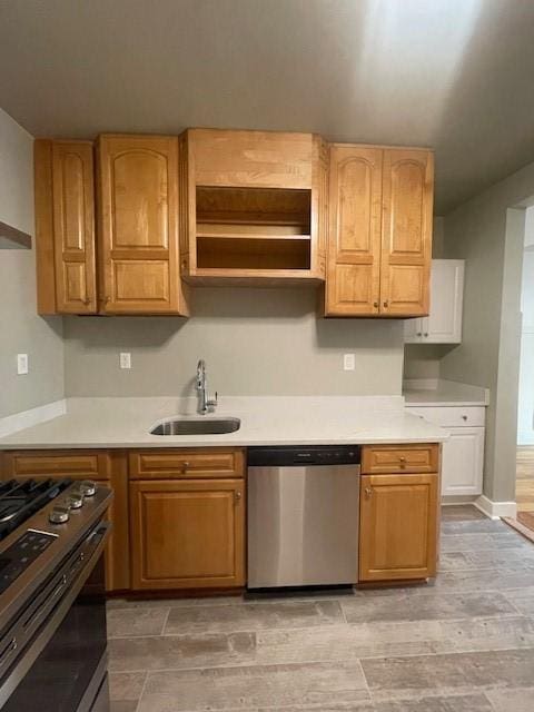 6605 Woodwell St, Squirrel Hill, PA 15217 - kitchen with light countertops, appliances with stainless steel finishes, baseboards, and a sink