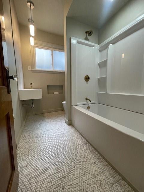 6605 Woodwell St, Squirrel Hill, PA 15217 - bathroom with washtub / shower combination, toilet, and baseboards