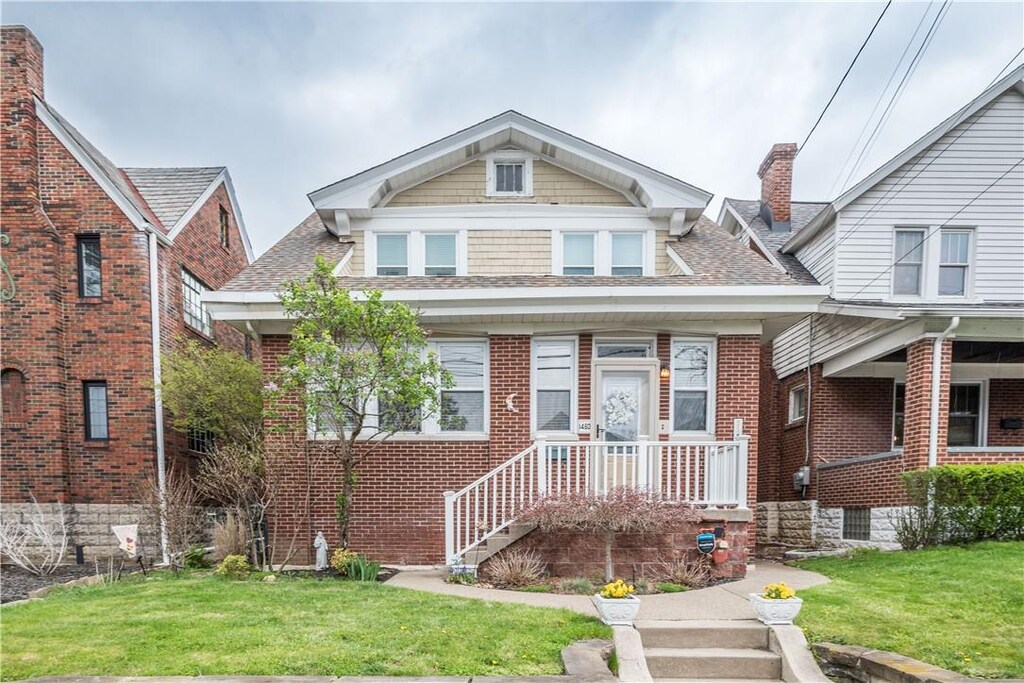 1460 Tolma Ave, Dormont, PA 15216 - view of front of property with brick siding, a front lawn, and roof with shingles