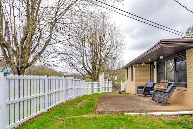 view of yard featuring a patio area and a fenced backyard