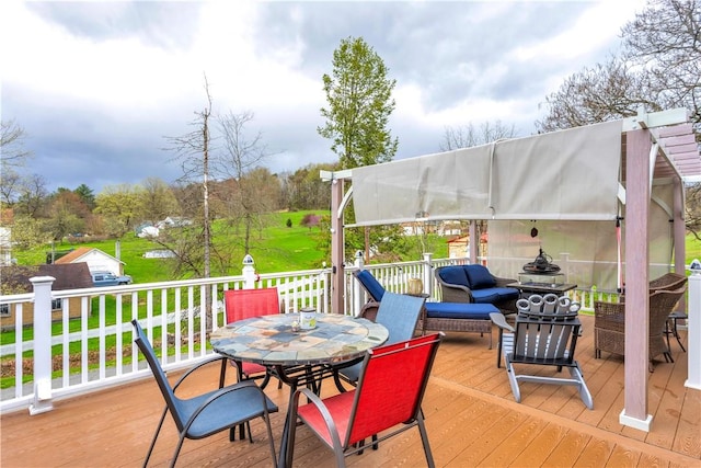 wooden deck with outdoor dining area