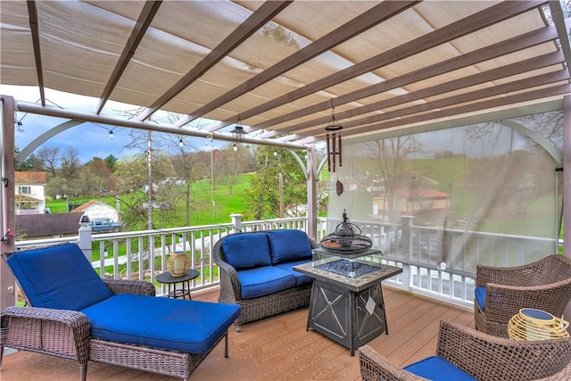 deck featuring a pergola and an outdoor living space with a fire pit