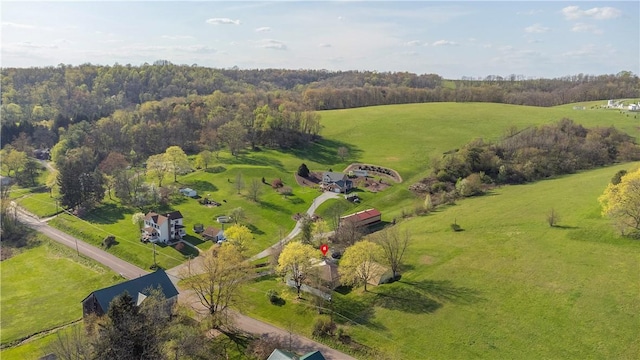 birds eye view of property with a rural view