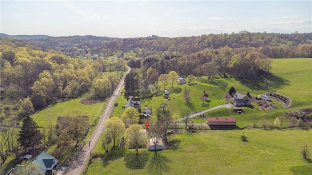 drone / aerial view with a rural view and a view of trees