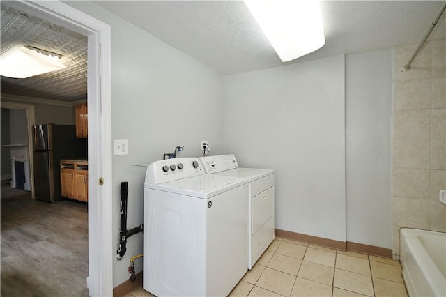 2331 Jane St, South Side, PA 15203 - washroom with washer and dryer, baseboards, and light tile patterned floors