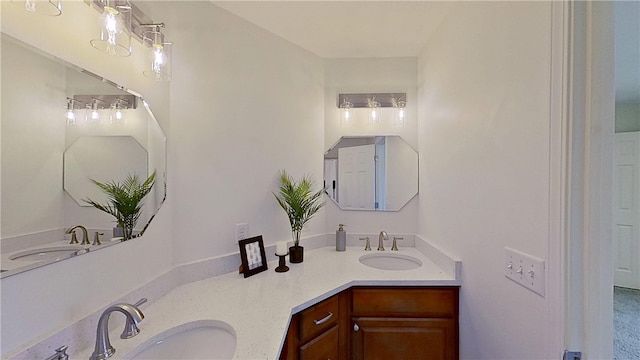 full bathroom featuring a sink and double vanity