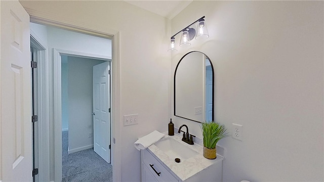 bathroom featuring baseboards and vanity