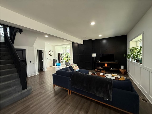 6755 Mcpherson Blvd, Point Breeze, PA 15208 - living room with a decorative wall, dark wood-style floors, and stairs