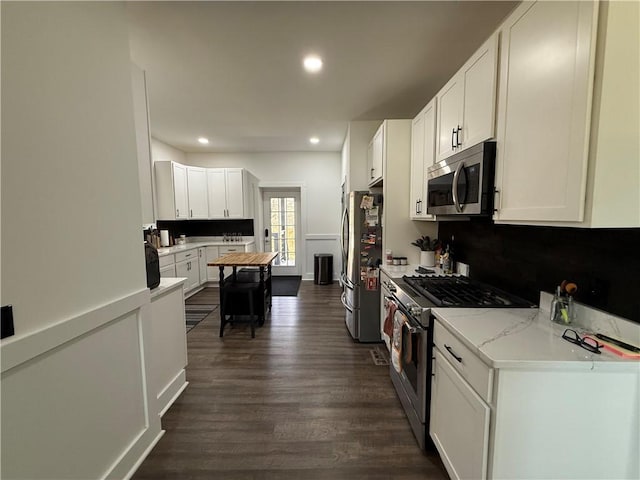 6755 Mcpherson Blvd, Point Breeze, PA 15208 - kitchen featuring white cabinets, recessed lighting, stainless steel appliances, dark wood-type flooring, and tasteful backsplash
