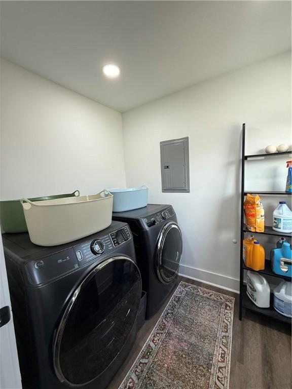 6755 Mcpherson Blvd, Point Breeze, PA 15208 - laundry room with electric panel, washer and clothes dryer, baseboards, wood finished floors, and laundry area