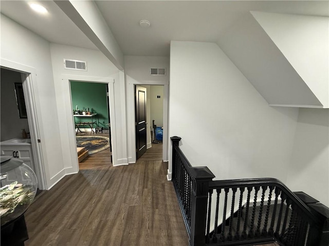 6755 Mcpherson Blvd, Point Breeze, PA 15208 - hallway featuring baseboards, visible vents, dark wood-style floors, and an upstairs landing