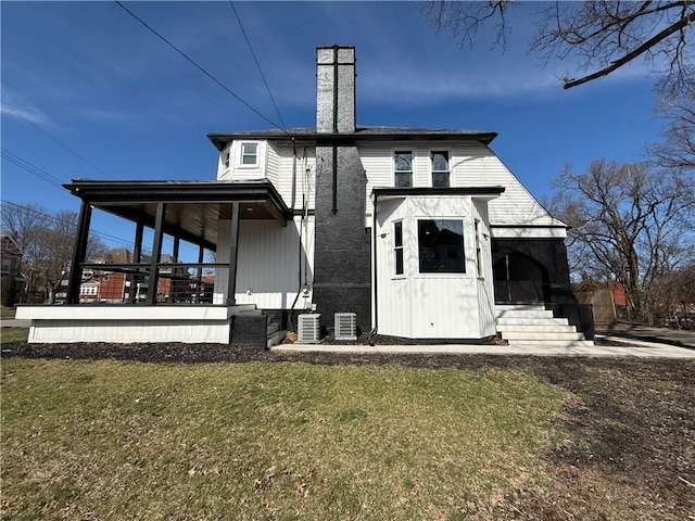 6755 Mcpherson Blvd, Point Breeze, PA 15208 - back of property with a lawn, a chimney, cooling unit, and covered porch