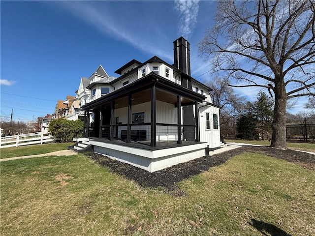 6755 Mcpherson Blvd, Point Breeze, PA 15208 - view of side of property featuring fence, a lawn, a porch, and a chimney