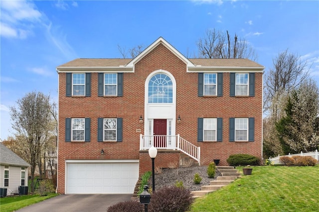 1743 Holmes Dr, Franklin Park, PA 15143 - view of front of property with brick siding, a front lawn, aphalt driveway, and a garage