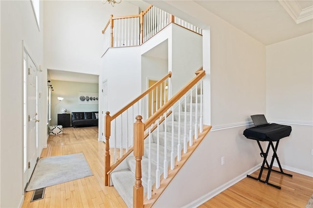 1743 Holmes Dr, Franklin Park, PA 15143 - stairs with baseboards, wood finished floors, and visible vents