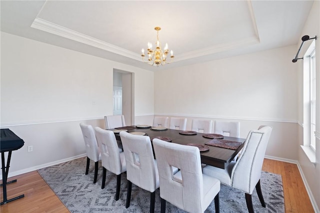 1743 Holmes Dr, Franklin Park, PA 15143 - dining space featuring ornamental molding, a notable chandelier, wood finished floors, and a raised ceiling