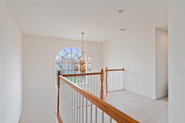 1743 Holmes Dr, Franklin Park, PA 15143 - corridor with an upstairs landing, carpet floors, a chandelier, and baseboards