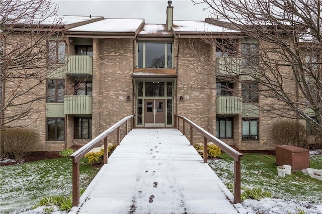 view of snow covered property