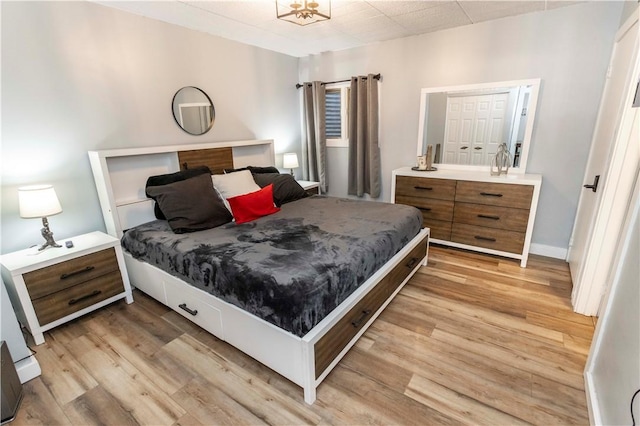 bedroom with light wood-type flooring