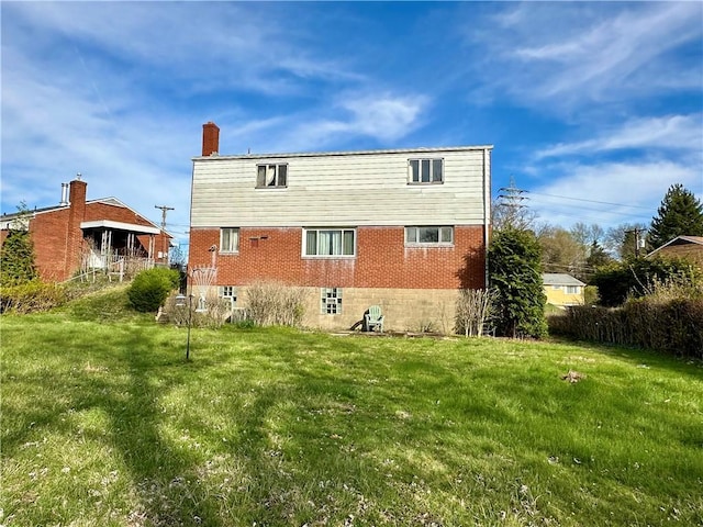 3157 Bel Air Dr, Whitehall, PA 15227 - back of property with brick siding, a yard, and a chimney