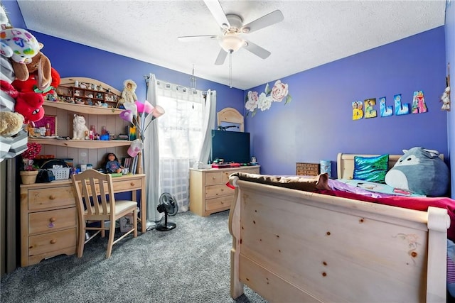 carpeted bedroom with a textured ceiling and ceiling fan