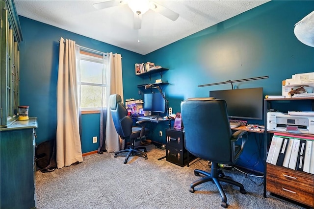 home office featuring ceiling fan and carpet