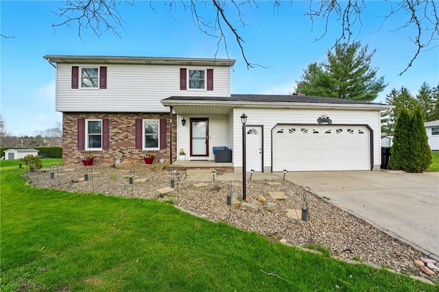 view of front of home with a garage, driveway, a front yard, and brick siding