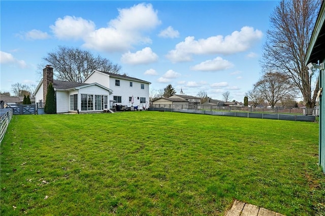view of yard with a fenced backyard