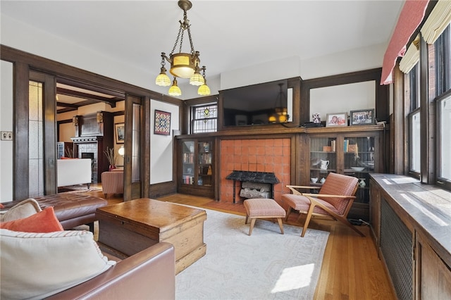 5818 Aylesboro Ave, Squirrel Hill, PA 15217 - living room with a tiled fireplace and wood finished floors