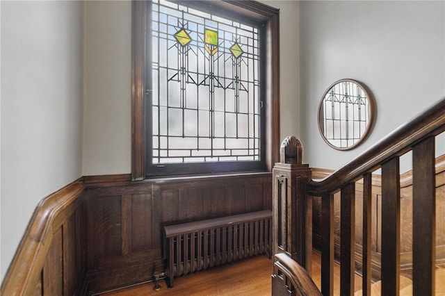 5818 Aylesboro Ave, Squirrel Hill, PA 15217 - entryway with radiator, wood finished floors, and a wainscoted wall