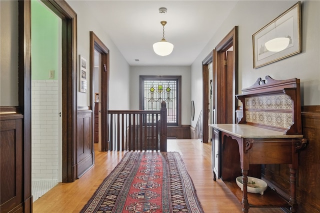 5818 Aylesboro Ave, Squirrel Hill, PA 15217 - corridor featuring an upstairs landing, light wood-style floors, and a wainscoted wall