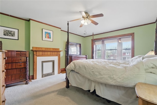 carpeted bedroom with crown molding, a ceiling fan, baseboards, and a fireplace