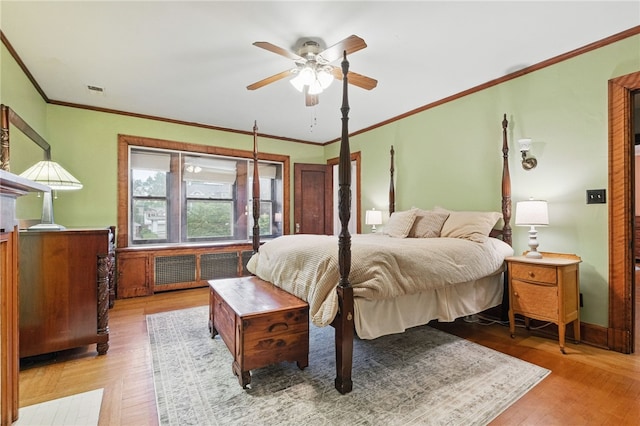5818 Aylesboro Ave, Squirrel Hill, PA 15217 - bedroom with light wood-style flooring, ornamental molding, ceiling fan, and radiator heating unit