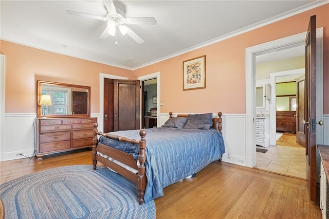 5818 Aylesboro Ave, Squirrel Hill, PA 15217 - bedroom with light wood finished floors, wainscoting, crown molding, a ceiling fan, and a closet
