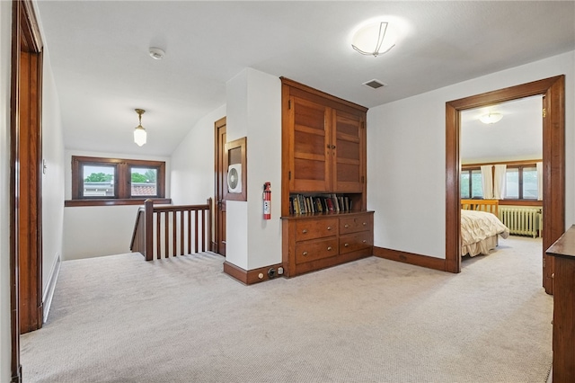 5818 Aylesboro Ave, Squirrel Hill, PA 15217 - corridor with radiator heating unit, an upstairs landing, light colored carpet, and baseboards
