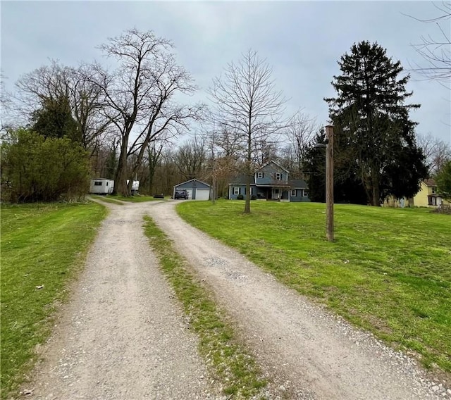 view of street featuring dirt driveway