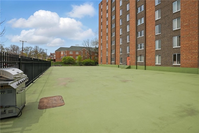 view of property's community featuring fence