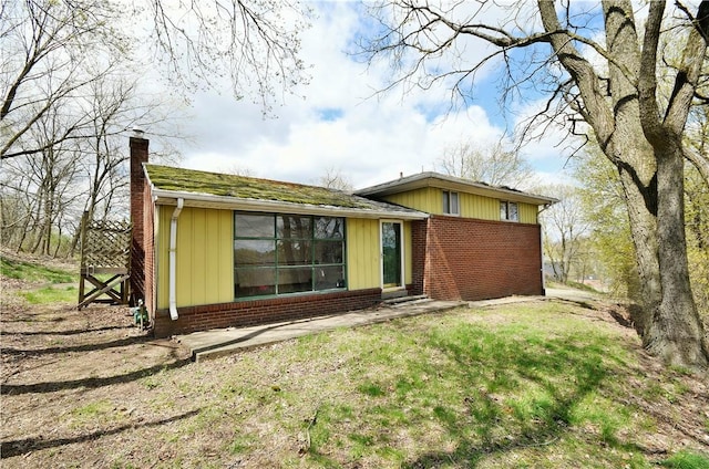 98 Reel Ave, Ross Twp, PA 15237 - rear view of property featuring brick siding and a chimney