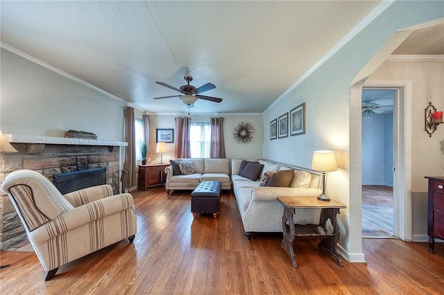 120 Arden Dr, Shaler, PA 15116 - living room featuring wood finished floors, a ceiling fan, and a stone fireplace
