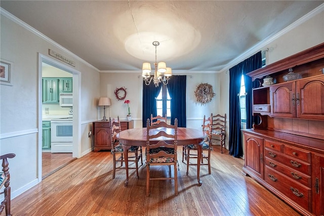 120 Arden Dr, Shaler, PA 15116 - dining room featuring ornamental molding, a chandelier, and light wood-style flooring