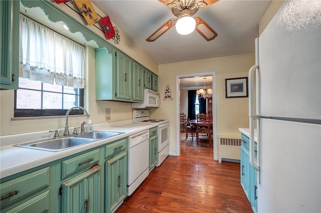 120 Arden Dr, Shaler, PA 15116 - kitchen with radiator heating unit, a sink, ceiling fan with notable chandelier, white appliances, and green cabinets