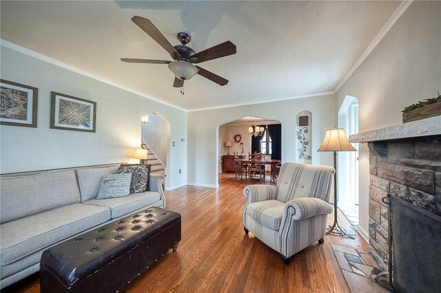 120 Arden Dr, Shaler, PA 15116 - living room with stairway, crown molding, wood finished floors, ceiling fan, and arched walkways