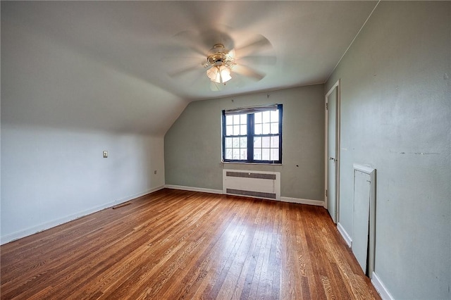 120 Arden Dr, Shaler, PA 15116 - additional living space with vaulted ceiling, hardwood / wood-style floors, ceiling fan, radiator, and baseboards
