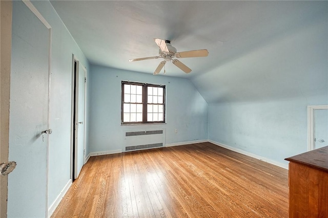 120 Arden Dr, Shaler, PA 15116 - bonus room featuring light wood-type flooring, vaulted ceiling, baseboards, radiator heating unit, and a ceiling fan