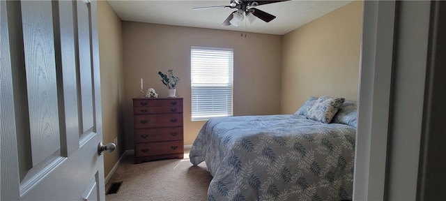 bedroom with baseboards, visible vents, a ceiling fan, and carpet flooring