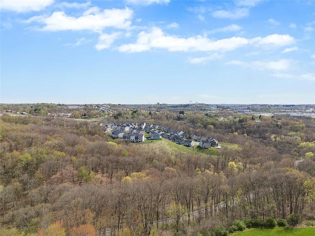 bird's eye view featuring a view of trees and a residential view
