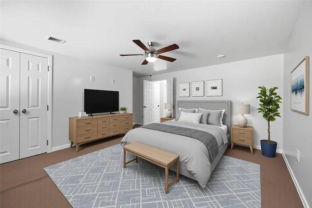 bedroom featuring carpet floors, visible vents, a ceiling fan, and baseboards