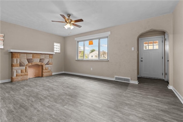 138 W Larkspur St, Munhall, PA 15120 - unfurnished living room featuring wood finished floors, visible vents, baseboards, and ceiling fan