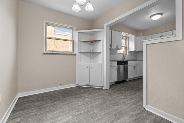 138 W Larkspur St, Munhall, PA 15120 - interior space featuring baseboards, dishwasher, dark wood-style floors, and a healthy amount of sunlight