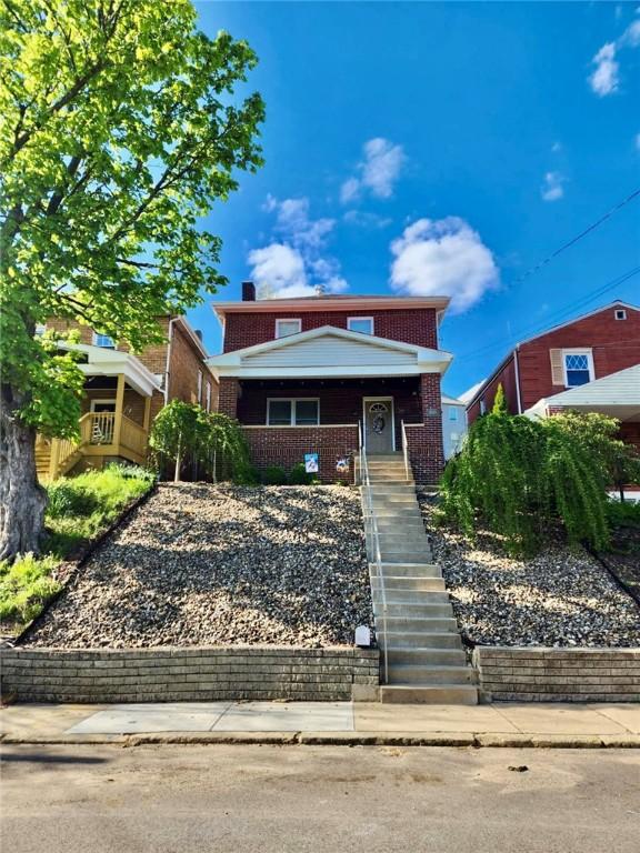 1816 Crosby Ave, Beechview, PA 15216 - view of front of property with stairway, covered porch, a chimney, and brick siding